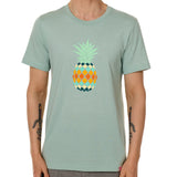 Front view of a male model wearing a dusty blue green short sleeve crew neck t-shirt with a vibrantly colored retro pineapple graphic on the front.