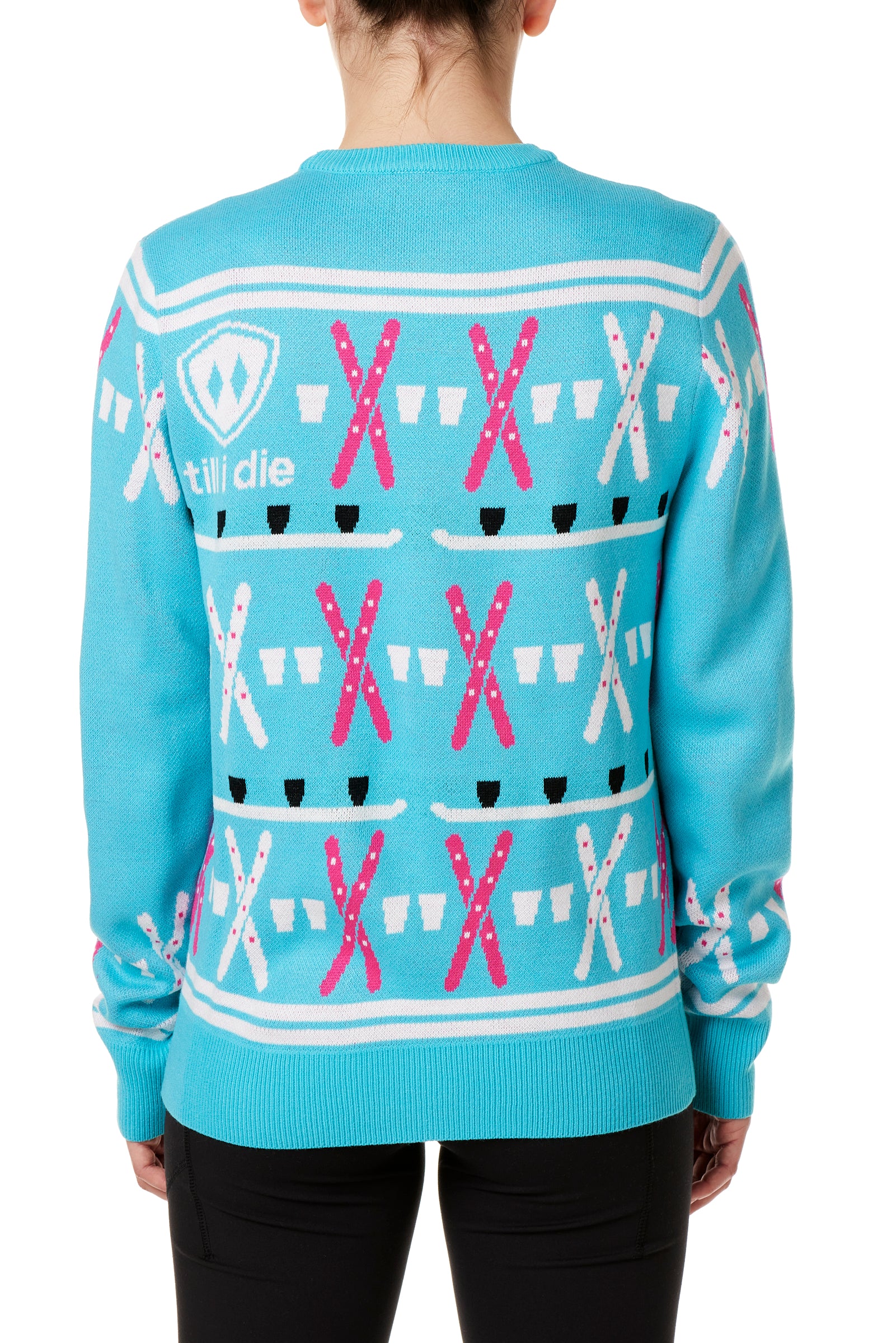 BACK OF A FEMALE MODEL WEARING A TEAL AND PINK SWEATER FEATURING SHOT SKI GRAPHICS