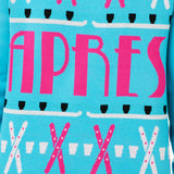 FRONT DETAIL OF A TEAL AND PINK SWEATER FEATURING SHOT SKI GRAPHICS AND THE WORD "APRES"
