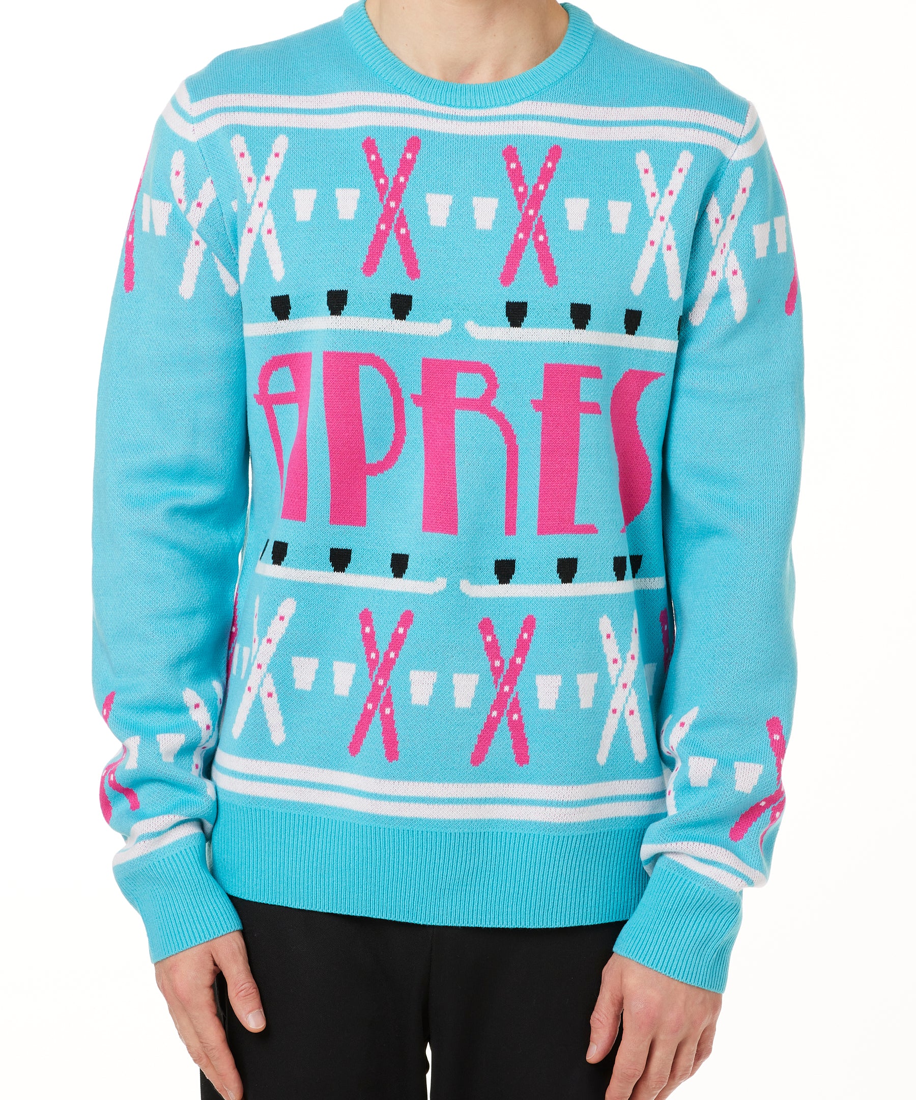 A male model wearing a TEAL AND PINK sweater with SHOT SKI GRAPHICS and the word 'APRES' written across the front.