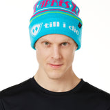 MALE MODEL WEARING A TEAL AND PINK HAT WITH A POM POM AND THE WORDS "APRES SKI"