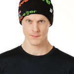 DETAIL OF A MALE MODEL WEARING A BLACK BEANIE WITH MULTICOLORED WORDS SAYING "DO WHAT YOU LOVE. DO IT FOREVER" 