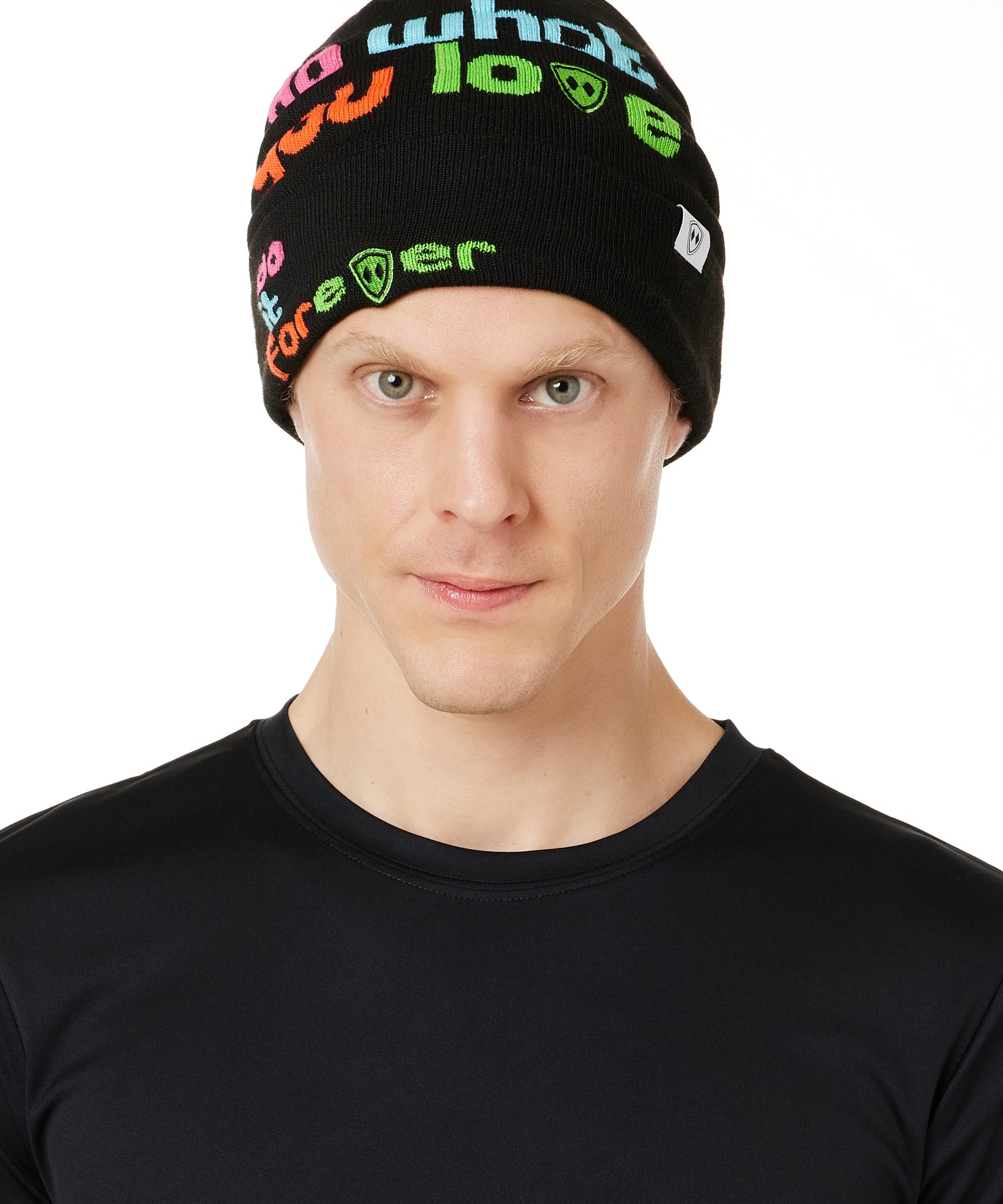DETAIL OF A MALE MODEL WEARING A BLACK BEANIE WITH MULTICOLORED WORDS SAYING "DO WHAT YOU LOVE. DO IT FOREVER" 