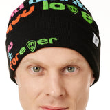 DETAIL OF A MALE MODEL WEARING A BLACK BEANIE WITH MULTICOLORED WORDS SAYING "DO WHAT YOU LOVE. DO IT FOREVER" 