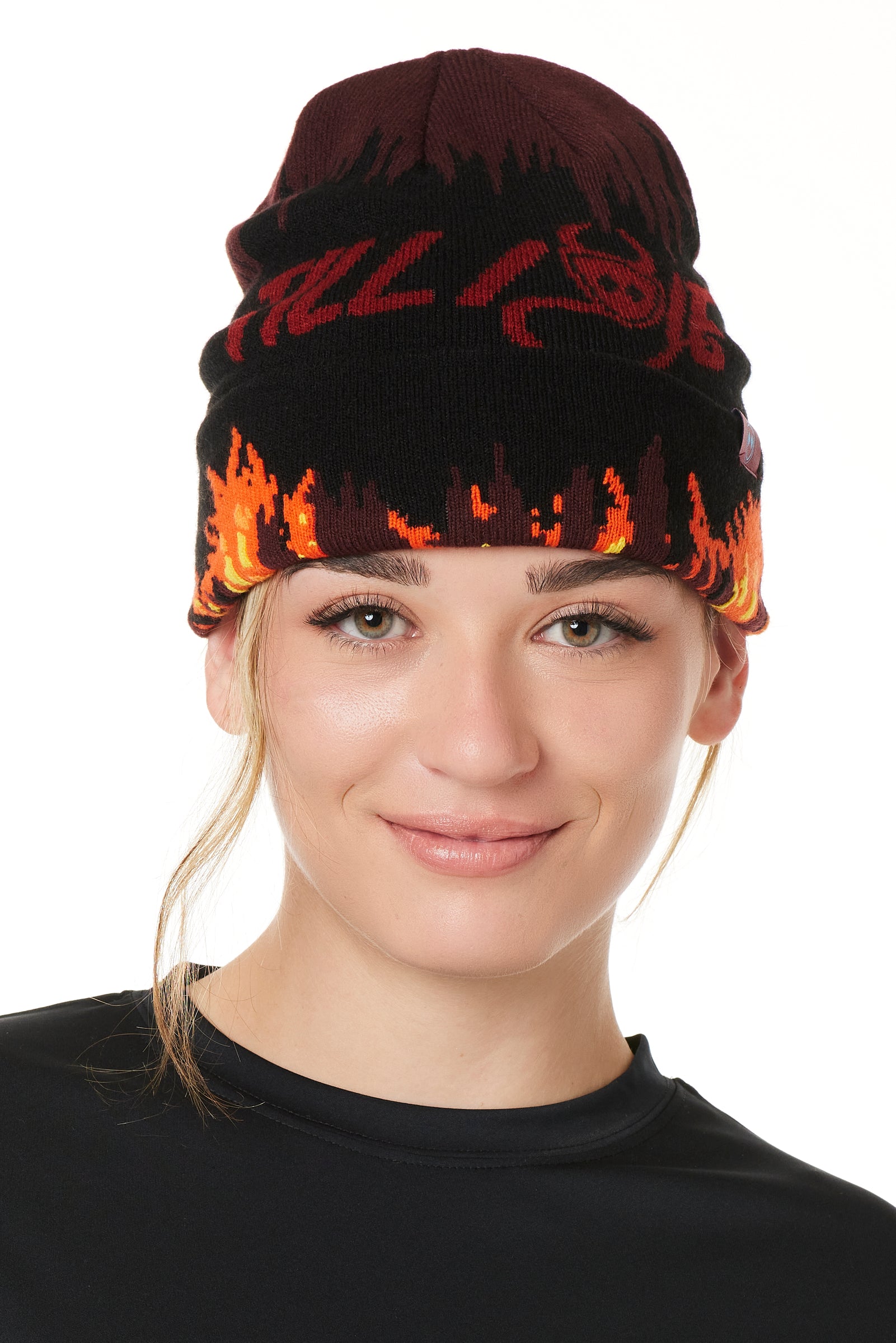 A FEMALE MODEL WEARING A BEANIE HAT WITH FLAMES AND THE WORDS "TILL I DIE"
