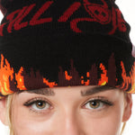 DETAIL OF A FEMALE MODEL WEARING A BEANIE HAT WITH FLAMES AND THE WORDS "TILL I DIE"