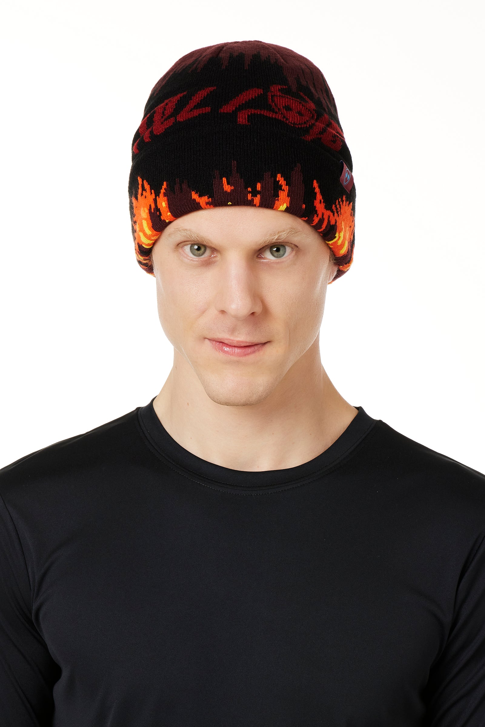 A MALE MODEL WEARING A BEANIE HAT WITH FLAMES AND THE WORDS "TILL I DIE"