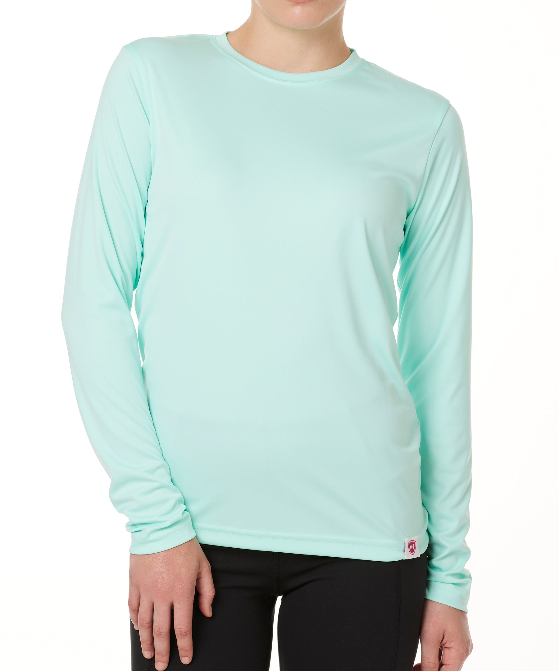 FEMALE MODEL WEARING A MINT GREEN LONG SLEEVE BASE LAYER