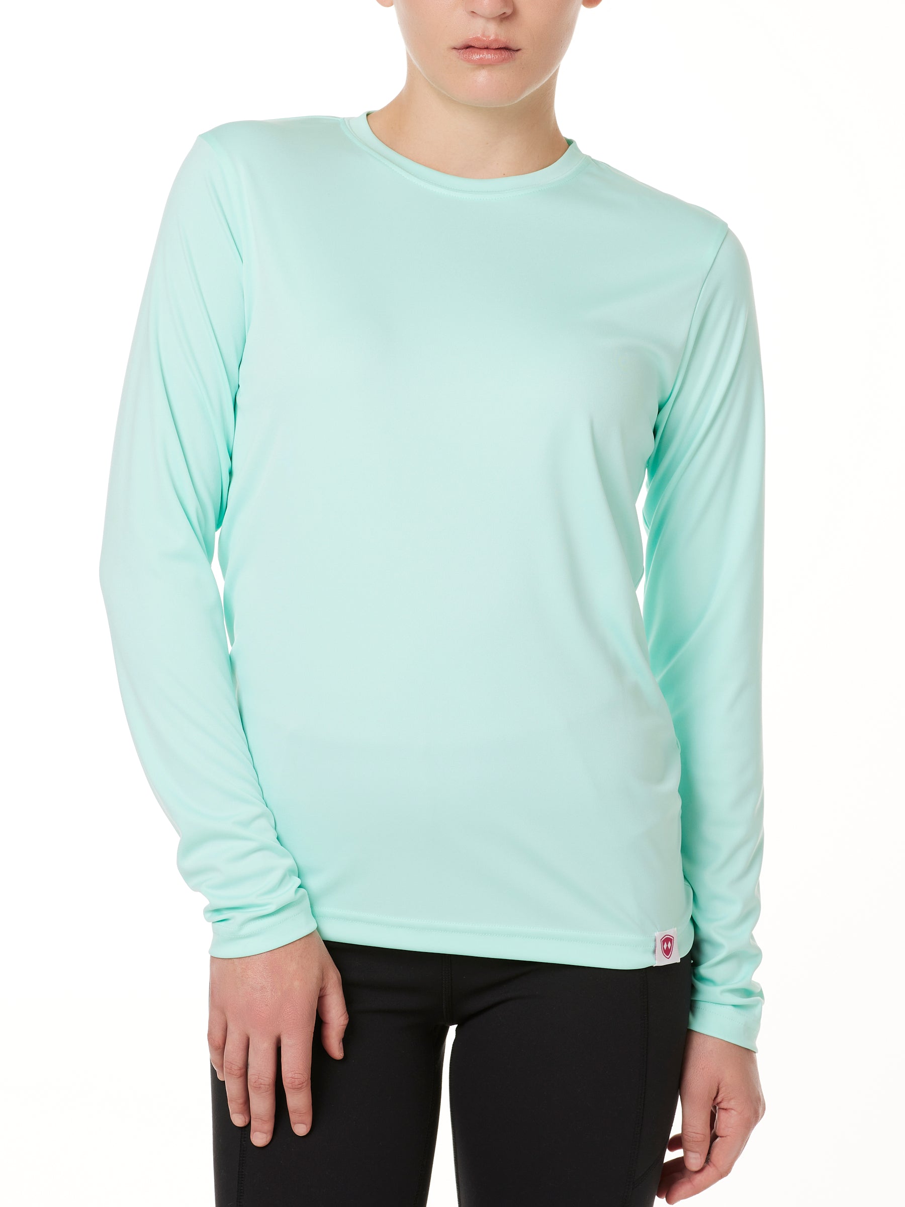 FEMALE MODEL WEARING A MINT GREEN LONG SLEEVE BASE LAYER