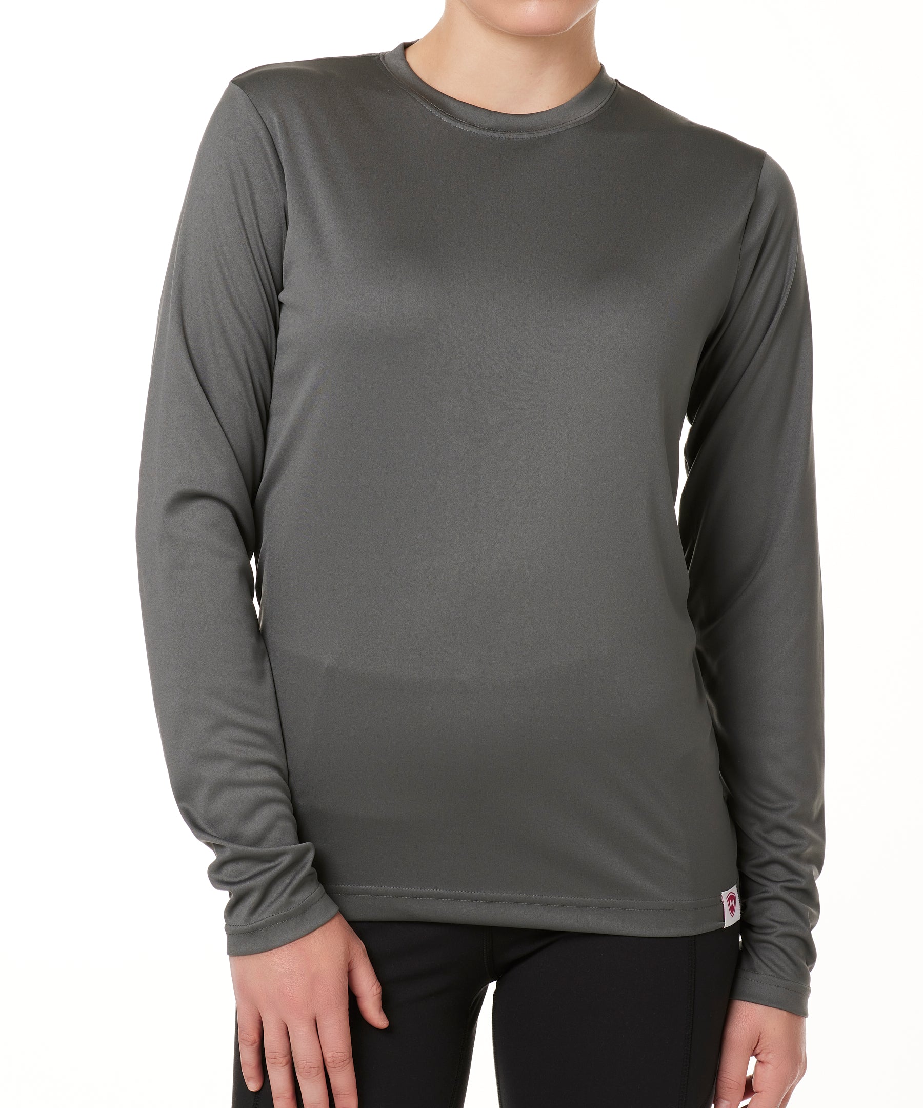 FEMALE MODEL WEARING A GRAY LONG SLEEVE PERFORMANCE LAYER