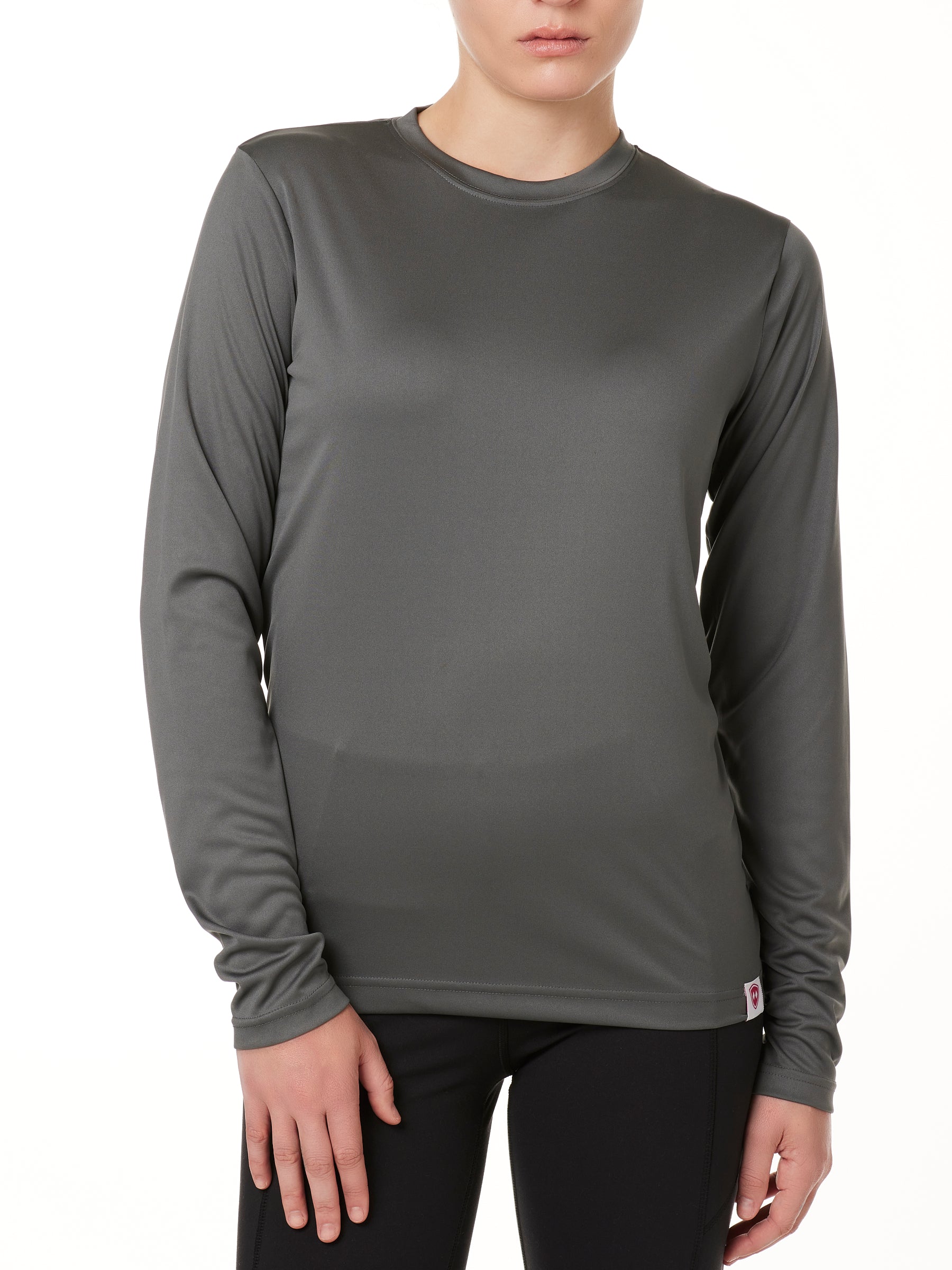 FEMALE MODEL WEARING A GRAY LONG SLEEVE PERFORMANCE LAYER