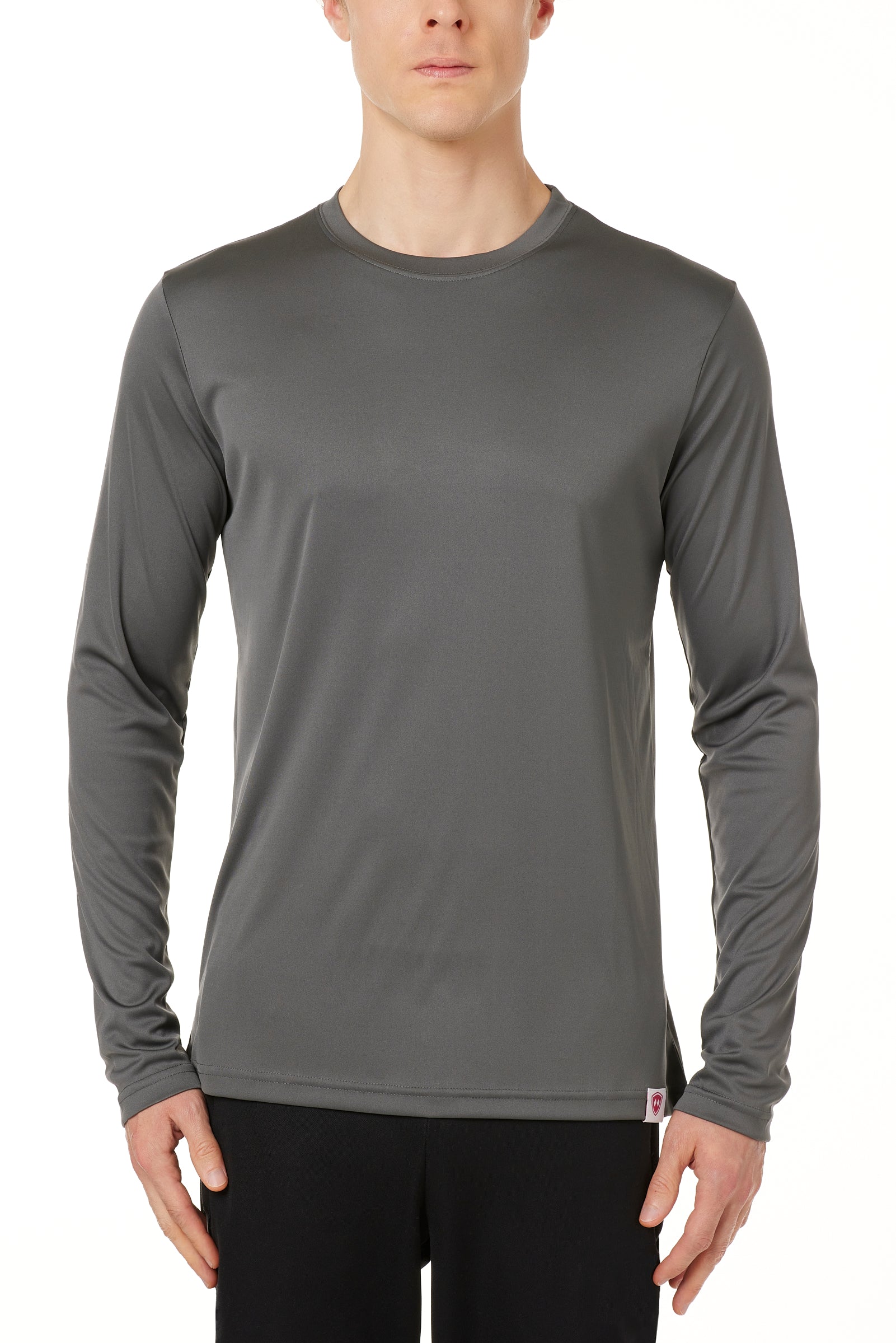 MALE MODEL WEARING A GRAY LONG SLEEVE PERFORMANCE LAYER