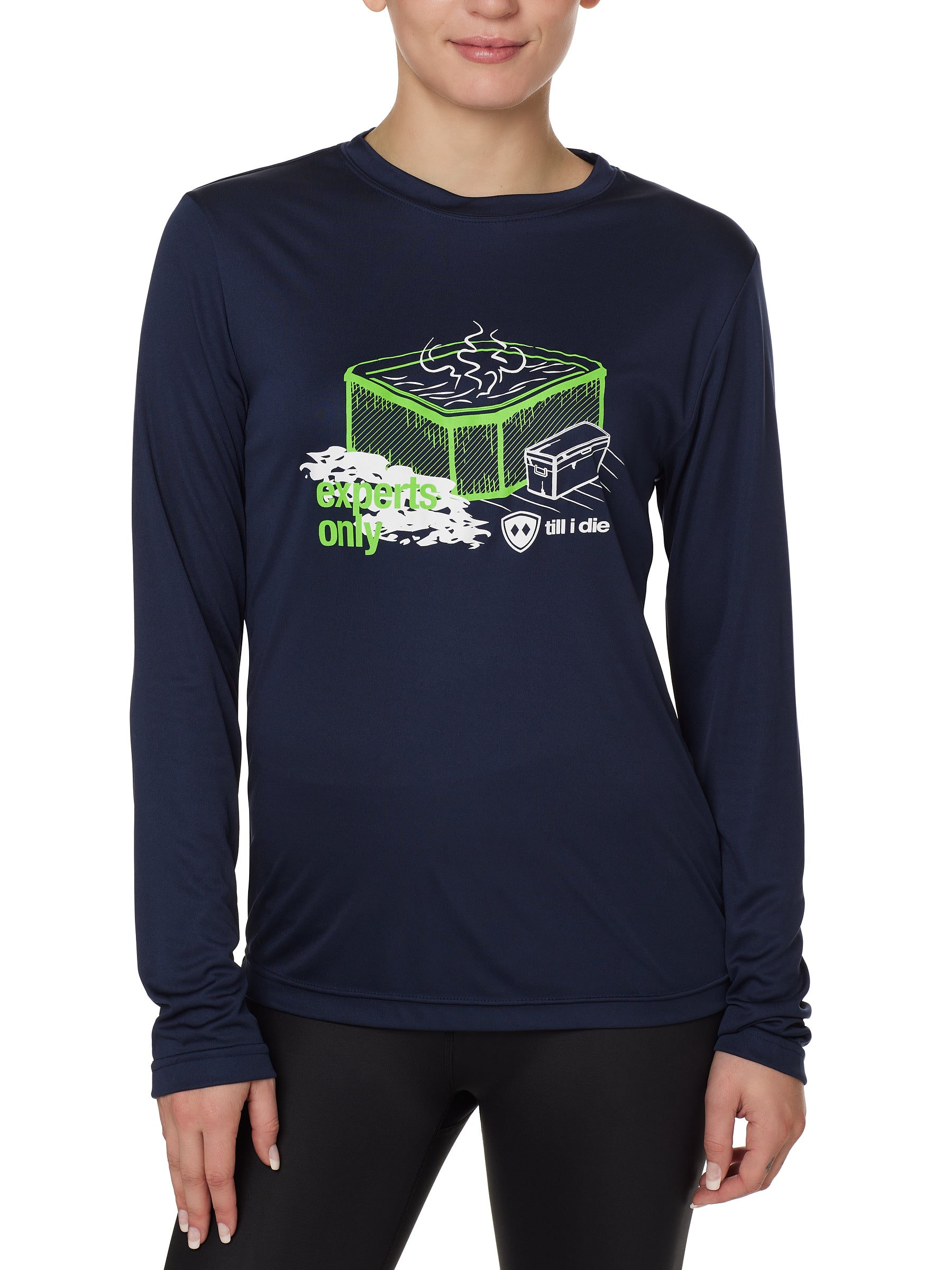 FEMALE MODEL WEARING A NAVY LONG SLEEVE PERFORMANCE SHIRT WITH A GRAPHIC OF A HOT TUB AND THE WORDS "EXPERTS ONLY"