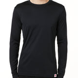 MALE MODEL WEARING A BLACK LONG SLEEVE PERFORMANCE LAYER