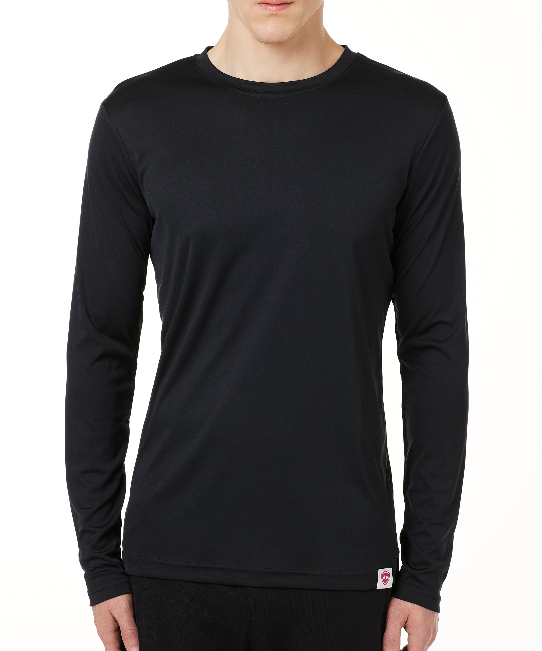 MALE MODEL WEARING A BLACK LONG SLEEVE PERFORMANCE LAYER