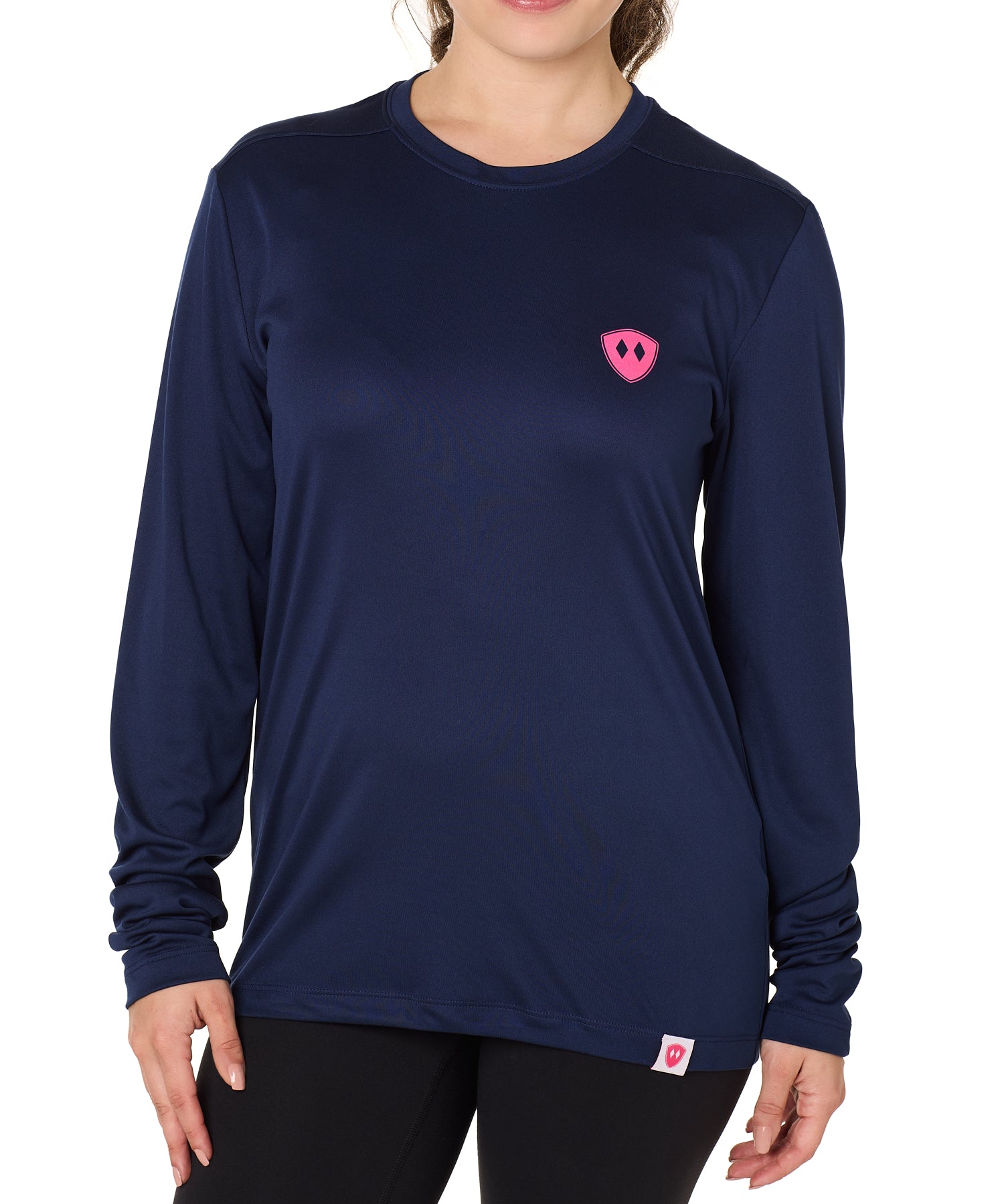 Front view of a female model wearing the Till I Die Bike performance long sleeve shirt in Navy on a white background. The shirt features a pink Double Diamond Shield logo on the wearer's left chest.