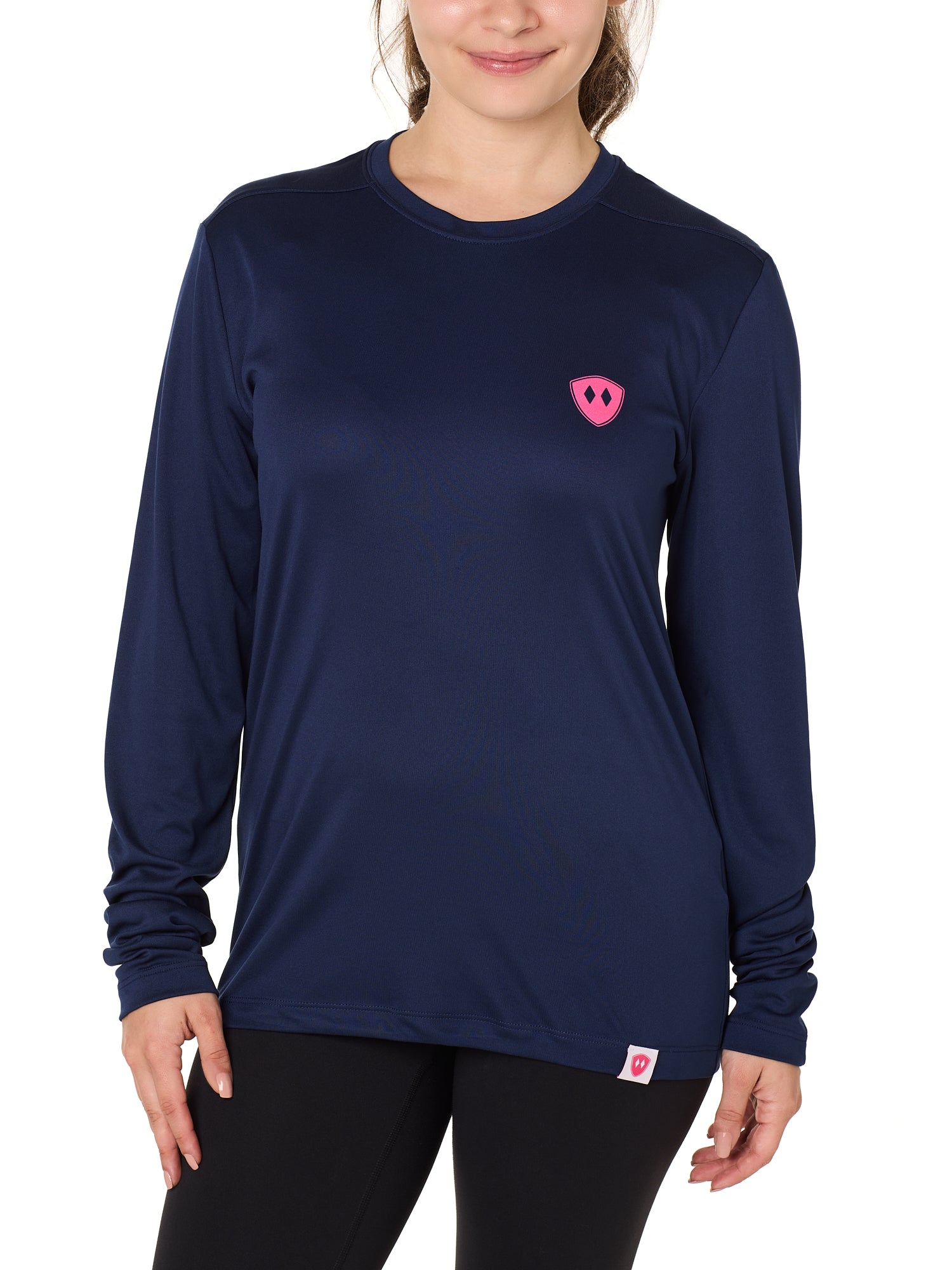 Front view of a female model wearing the Till I Die Bike performance long sleeve shirt in Navy on a white background. The shirt features a pink Double Diamond Shield logo on the wearer's left chest.
