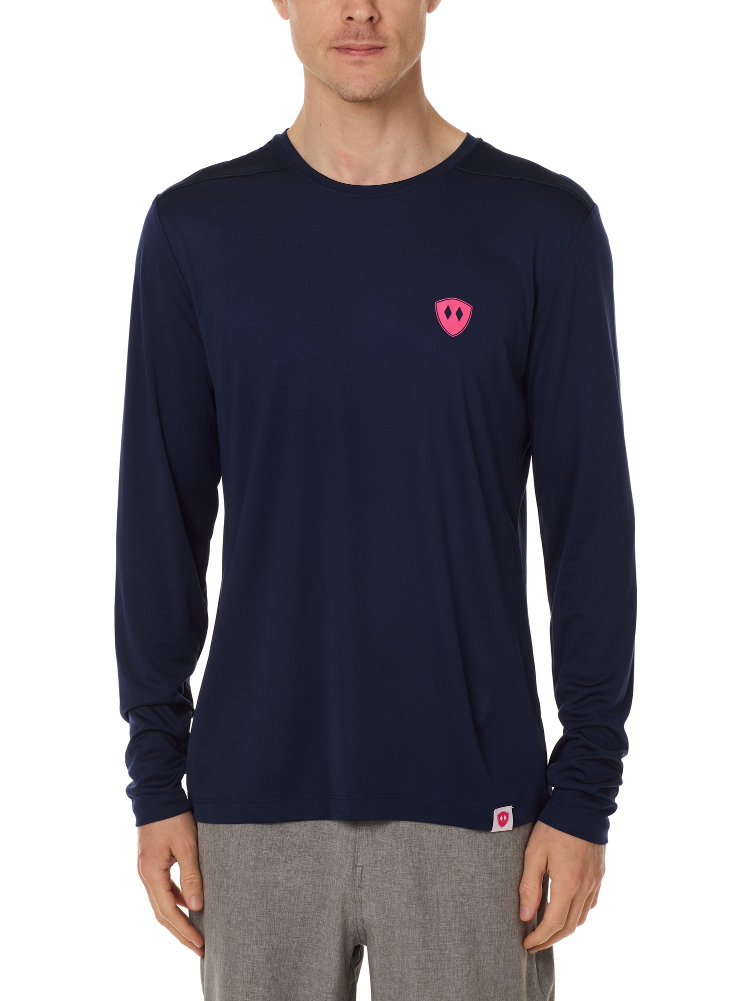 Front view of a male model wearing the Till I Die Bike performance long sleeve shirt in Navy on a white background. The shirt features a pink Double Diamond Shield logo on the wearer's left chest.
