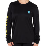 Front view of a female model wearing the Gear Head performance long sleeve tee in black on a white background. Accented with a cyan blue double diamond shield over wearers left chest.