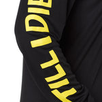 sleeve detail of the gear head performance long sleeve shirt in black featuring yellow block letter 'till i die' text