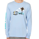 Front view of a male model wearing the Hammock long sleeve tee in light blue, displayed on a white background. The graphic depicts a vintage VW bus parked on a beach, with a surfboard leaning against it and a silhouetted figure relaxing in a hammock strung between the van and a palm tree.