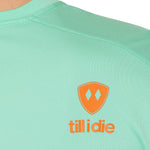 back detail of a mint green performance long sleeve accented with an orange till i die logo