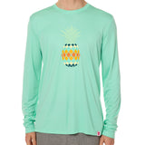Front view of a male model wearing a mint green long sleeve performance shirt with a vibrantly colored retro pineapple graphic on the front.
