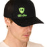 Front view of a male model wearing a black classic trucker hat, featuring a lime green embroidered Till I Die logo on the lower right front panel.