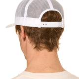 Back view of a male model wearing a classic white trucker hat featuring the mesh back panels and matching white snapback closure