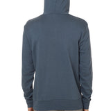 Back view of a male model wearing the Summer night hoodie in washed denim on a white background. 