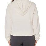 Back view of a female model wearing the vintage white classic hoodie