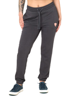 Front view of a female model wearing the women's summer night charcoal joggers. The joggers have a dyed to match drawstring and coral and white embroidered double diamond logo near the left pocket.