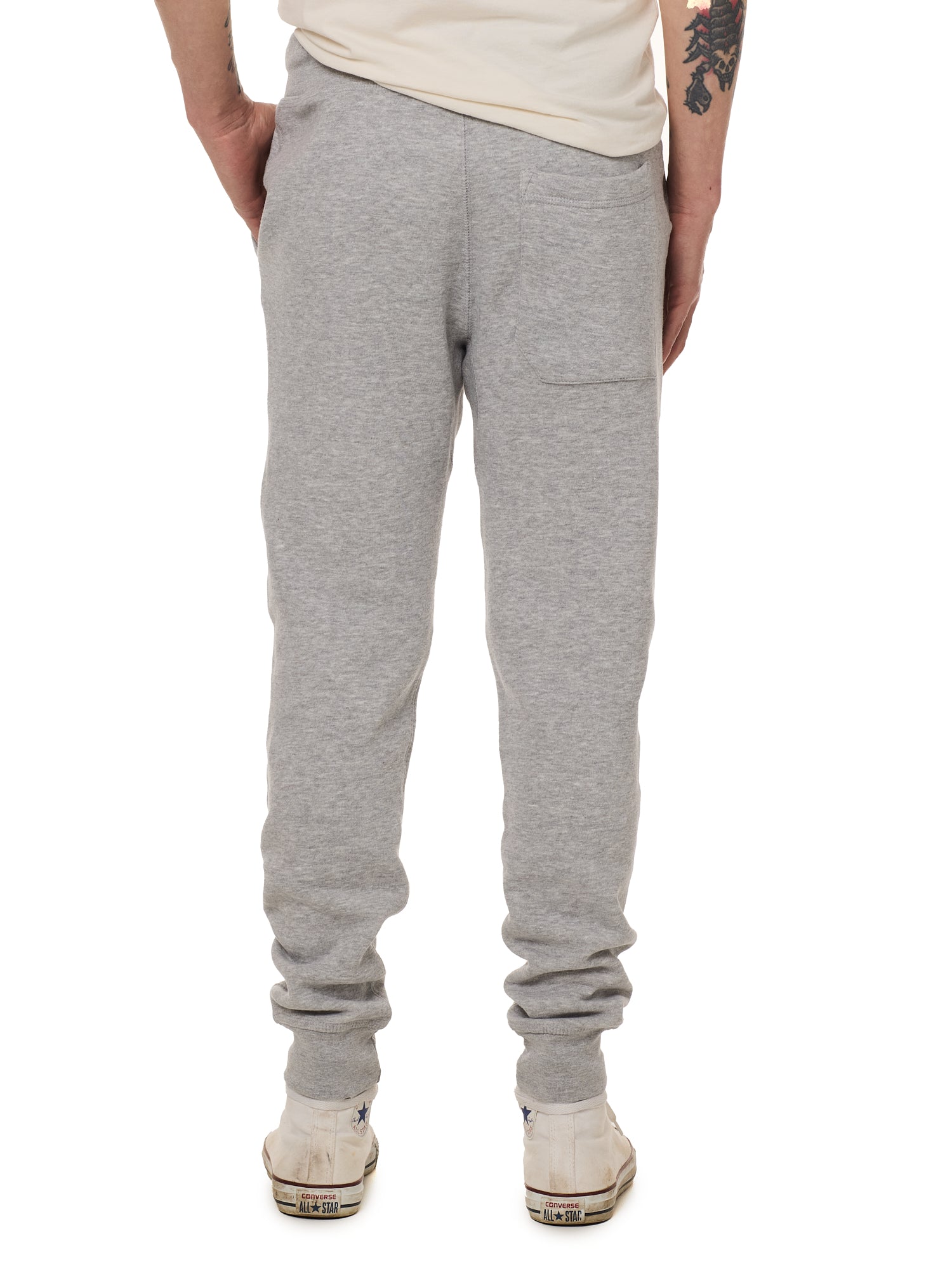 Back view of a male model wearing the Men's summer night heather gray joggers.  Featuring a back pocket on the wearers right.