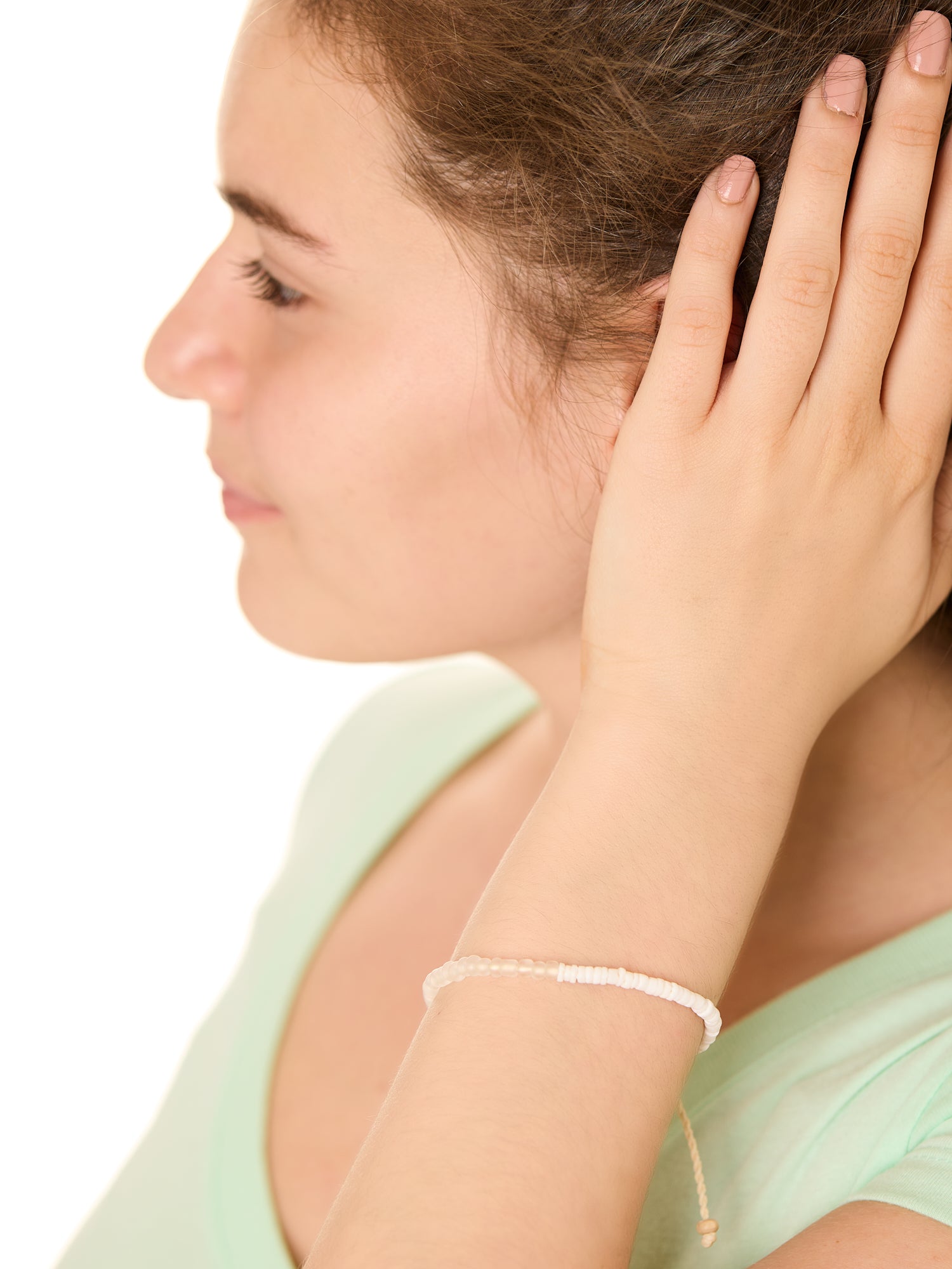 close up view of a female model wearing the White Surf and Sand bracelet