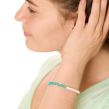 close up view of a female model wearing the Turquoise Surf and Sand bracelet