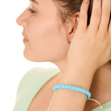 close up view of a female model wearing the blue Bali surf beads bracelet