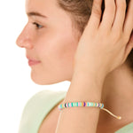 close up view of a female model wearing the multicolored Bali surf beads bracelet