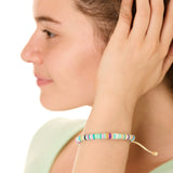 close up view of a female model wearing the multicolored Bali surf beads bracelet