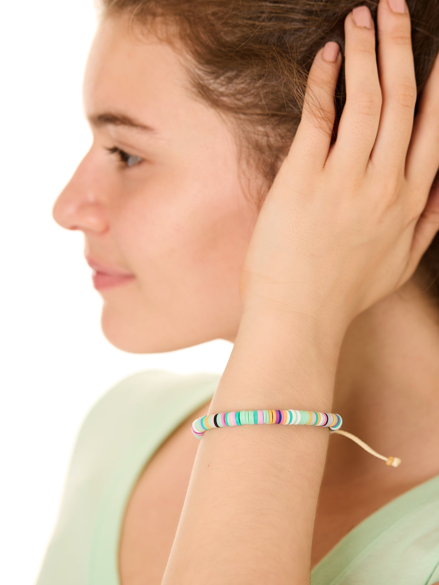 close up view of a female model wearing the multicolored Bali surf beads bracelet