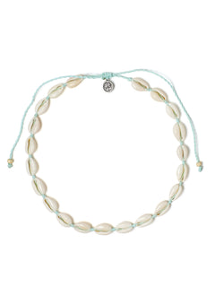 Top view of the Outer Banks Cowrie Choker on a white background, featuring an adjustable light teal drawcord, natural color cowrie shells, and a silver palm tree charm.