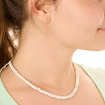 Close-up view of a female model wearing the gray Echoes of Atlantis necklace 