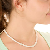 Close-up view of a female model wearing the gray Echoes of Atlantis necklace 