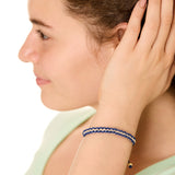close up view of a female model wearing the surfers knot bracelet
