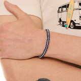 close up view of a male model wearing the surfer knot bracelet 