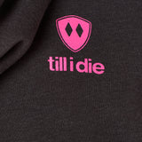 Detail of the hot pink till i die logo on a heather black hoodie