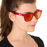 front view of a female model wearing the ruby riptide sunglasses on a white background