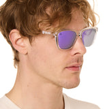 front view of a male model wearing the violet haze sunglasses on a white background