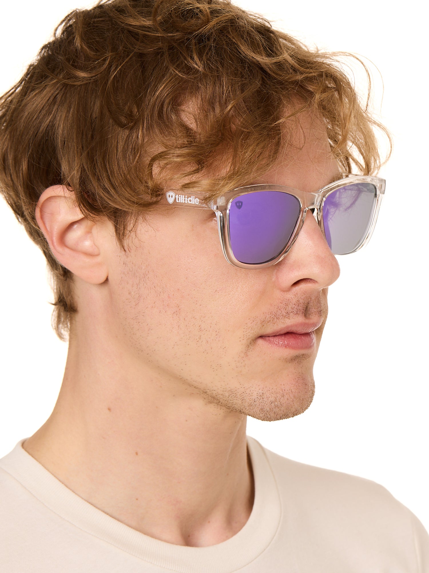 front view of a male model wearing the violet haze sunglasses on a white background