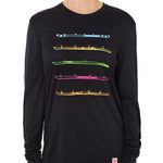 Front view of a female model wearing the black Shot Ski performance long sleeve shirt on a white background. Graphic features five multicolored shot skis illustrated in a line art style across the front.