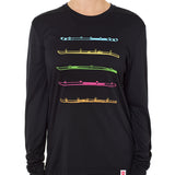 Front view of a female model wearing the black Shot Ski performance long sleeve shirt on a white background. Graphic features five multicolored shot skis illustrated in a line art style across the front.
